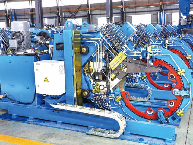 Automated wire strapping machine for long products
